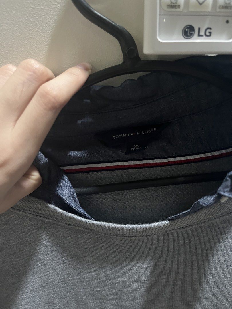 Tommy Hilfiger Grey Layered Sweater (Category: Coats, Jackets and Outerwear) located in Balanga. Submitted by sagekinsclothingstore (Listing ID 1466500386, Image 1). Description: Cute little sweatshirt! 💫 I never wore this, only stored because of the weather sa PH 😅 - Brand: Tommy Hilfiger - Size: XS (fits true to size) - Condition: Excellent pre-loved condition.
