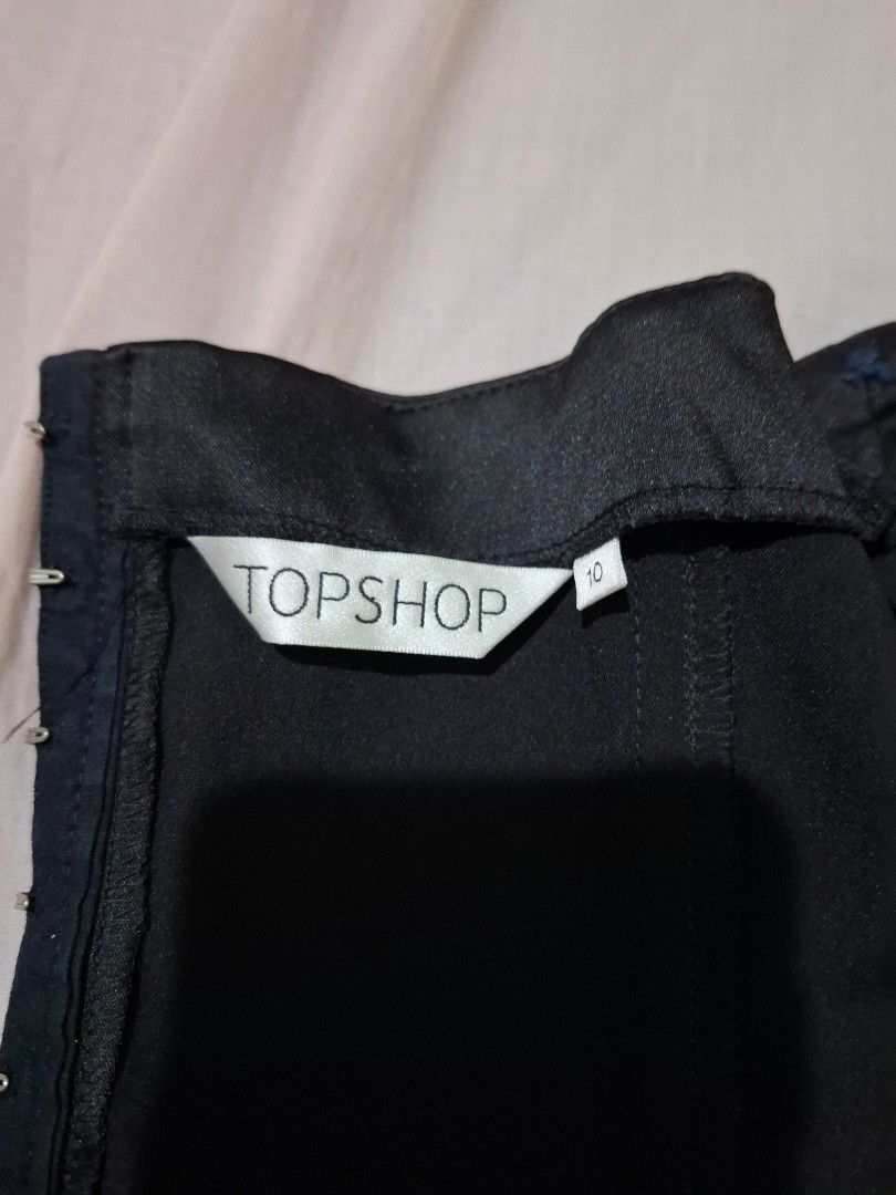 Topshop Black Corset Size 10 (Category: Sleeveless) located in Tuguegarao City. Submitted by potaetonim (Listing ID 1466481530, Image 2). Description: - Brand: Topshop - Size: UK 10 / Euro 38 - Color: Classic Black - Closure: Hook and eye front closure - Details: Structured boning throughout for a flattering fit - Origin: Made in Lithuania - Condition: Excellent.