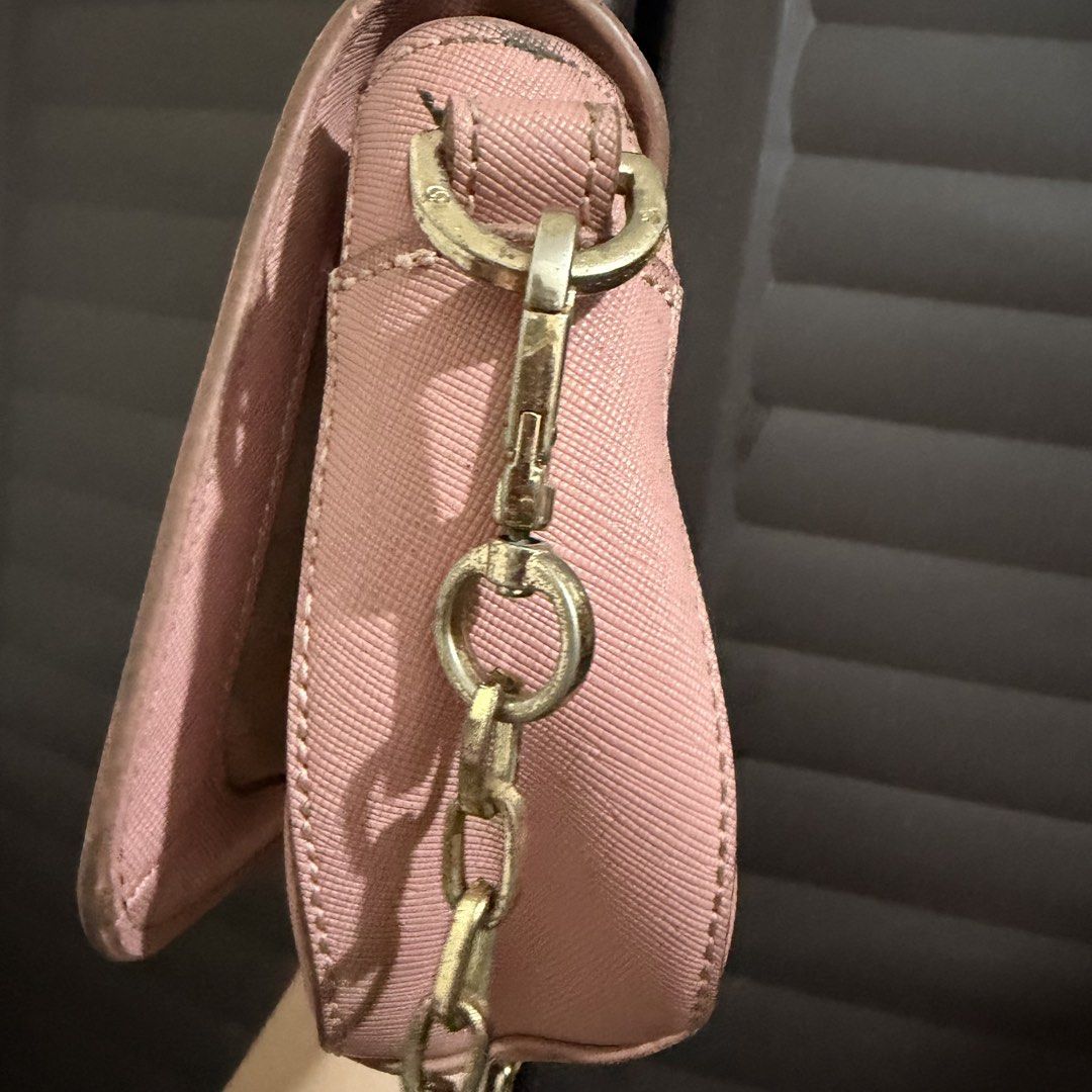 Tory Burch Pink Crossbody Bag (Category: Luxury Bags & Wallets) located in Rizal. Submitted by lovegclothingph (Listing ID 1466474964, Image 3). Description: - Brand: Tory Burch - Material: Durable pink Saffiano leather - Hardware: Gold-tone with matching chain strap and front logo clasp - Closure: Secure snap flap - Size: Compact, ideal for daily essentials - Condition: Pre-loved with minor edge wear and light hardware tarnish (please check phot