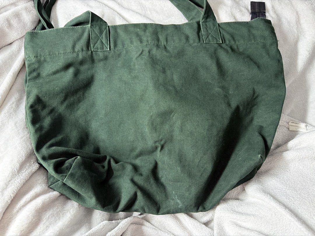 Tote Story Studios (Category: Tote Bags) located in Los Banos. Submitted by sashimituna (Listing ID 1466473020, Image 2). Description: - Color: Dark green with white 'SLOW SUNDAY' text - Material: Durable cotton canvas - Straps: Sturdy double shoulder straps - Design: Printed front, plain solid back - Usage: Ideal everyday bag for groceries, books, and errands.