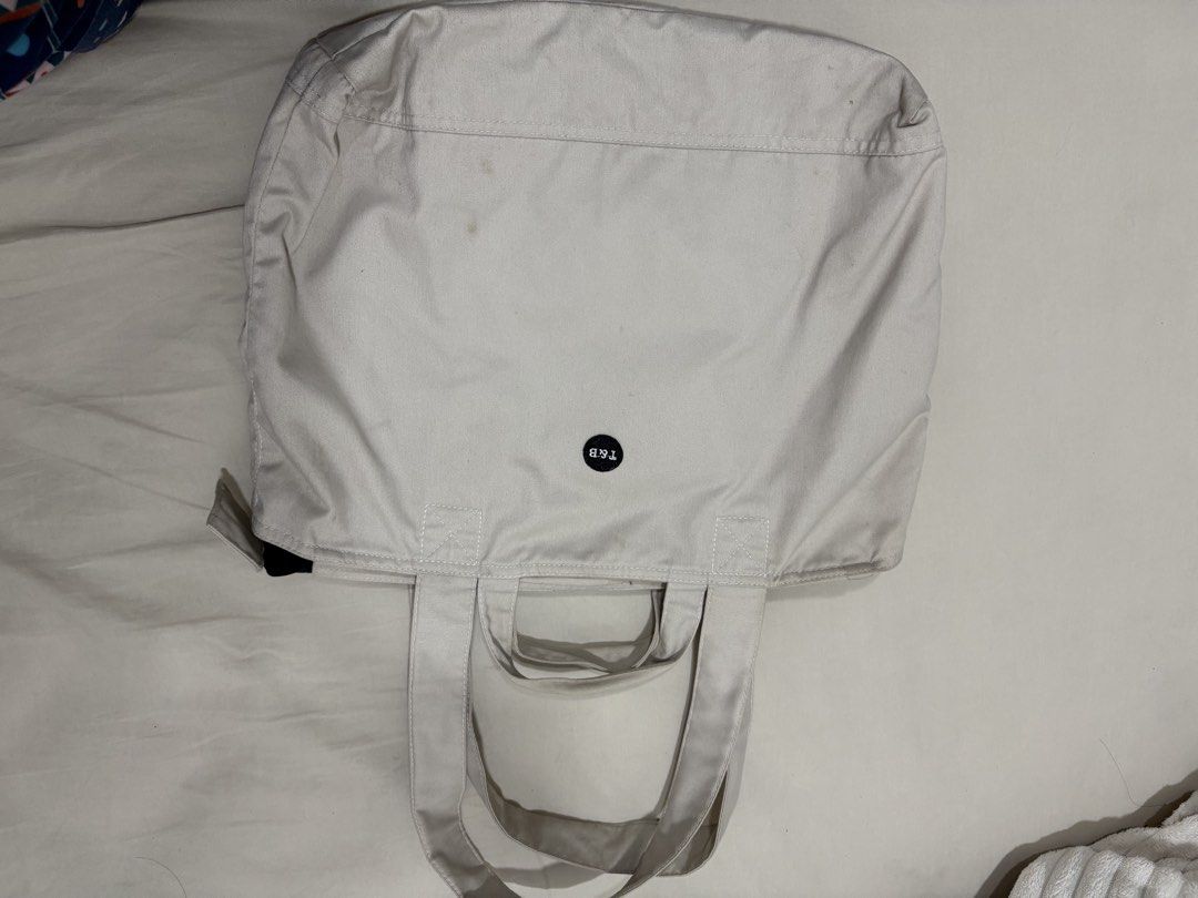 Totes & Beyond Canvas Tote Bag Off White (Category: Tote Bags) located in Mandaluyong City. Submitted by annab11 (Listing ID 1466562044, Image 3). Description: - Brand: Totes & Beyond - Color: Versatile off-white canvas - Carry options: Double hand handles and longer shoulder straps - Storage: Front patch pocket and roomy interior for books, essentials, or a laptop - Closure: Secure zip top - Condition: Minor signs of wear on the fabric.