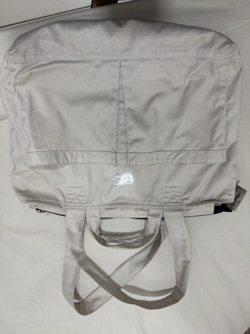 Totes & Beyond Canvas Tote Bag Off White (Category: Tote Bags) located in Mandaluyong City. Submitted by annab11 (Listing ID 1466562044, Image 2). Description: - Brand: Totes & Beyond - Color: Versatile off-white canvas - Carry options: Double hand handles and longer shoulder straps - Storage: Front patch pocket and roomy interior for books, essentials, or a laptop - Closure: Secure zip top - Condition: Minor signs of wear on the fabric.