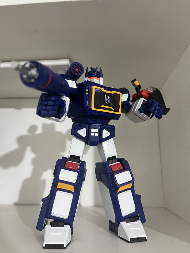 Transformers Soundwave Action Figure Decepticon Robot (Category: Action & Battle Toys) located in Quezon City. Submitted by renzo__01 (Listing ID 1466493622, Image 1). Description: - Character: Transformers Soundwave action figure - Design: Classic blue, white, and yellow color scheme with Decepticon logo - Articulation: Fully poseable joints for dynamic displays - Accessories: Includes shoulder cannon and hand blaster weapons - Condition: Clean 