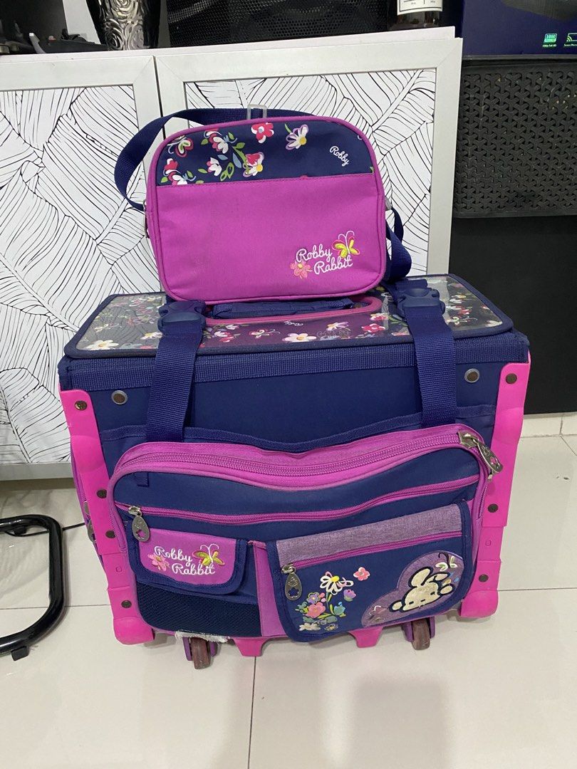 Trolley bag(robby rabbit) school bag (Category: Babies & Kids Fashion) located in Quezon City. Submitted by zttrendshoppe (Listing ID 1466360248, Image 2). Description: Well used. Robby rabbit trolley bag with lunchbag and sides with small bag for tumbler and multipurpose pouch. .