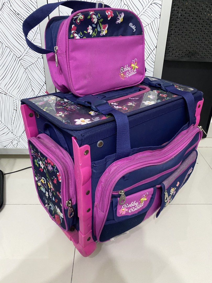 Trolley bag(robby rabbit) school bag (Category: Babies & Kids Fashion) located in Quezon City. Submitted by zttrendshoppe (Listing ID 1466360248, Image 1). Description: Well used. Robby rabbit trolley bag with lunchbag and sides with small bag for tumbler and multipurpose pouch. .