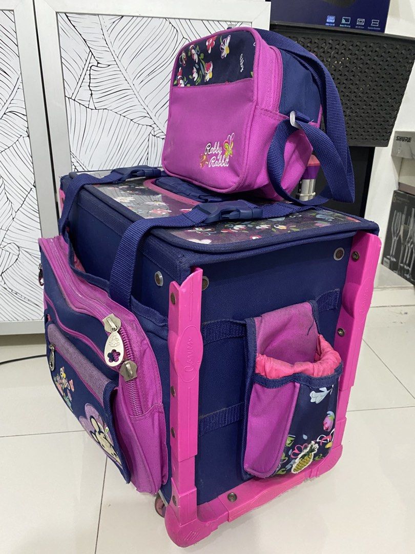 Trolley bag(robby rabbit) school bag (Category: Babies & Kids Fashion) located in Quezon City. Submitted by zttrendshoppe (Listing ID 1466360248, Image 3). Description: Well used. Robby rabbit trolley bag with lunchbag and sides with small bag for tumbler and multipurpose pouch. .