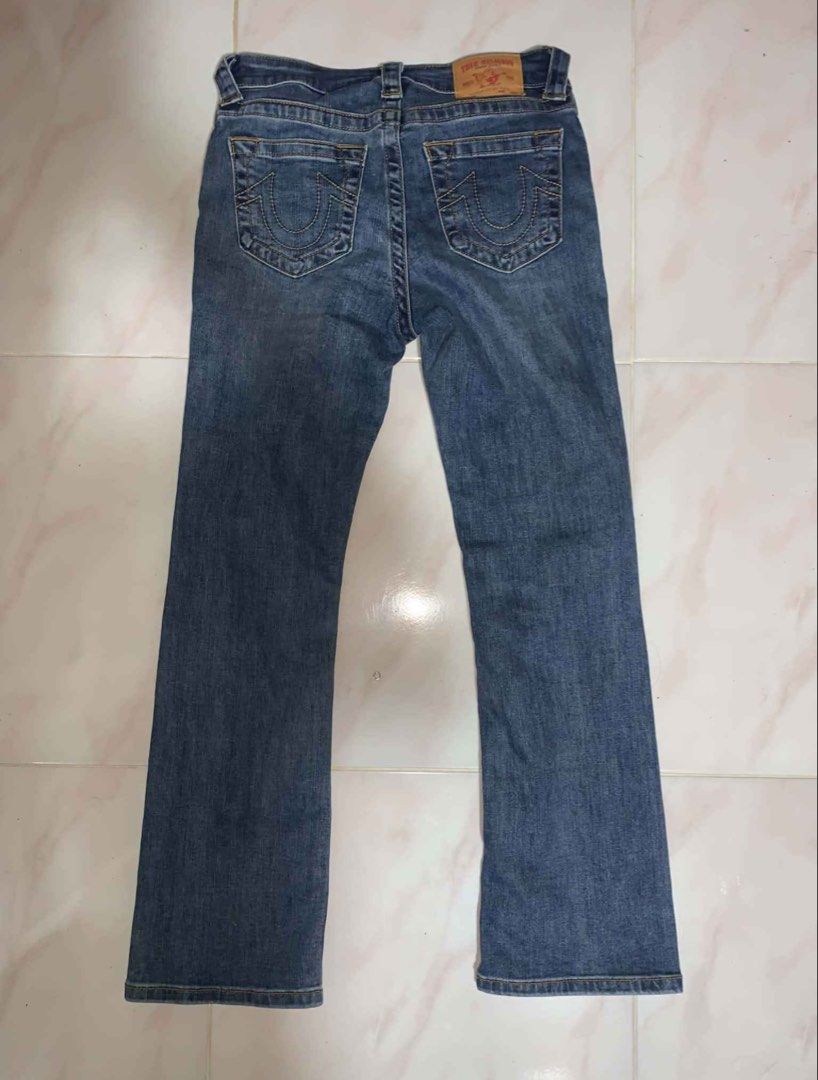 True Religion Boot cut Jeans (Category: Jeans) located in Bacoor. Submitted by migo.o (Listing ID 1466346787, Image 2). Description: - Brand: True Religion -W:27-28 -L:37 -bought it from IG thrift for 800 -rfs: too small - Color/Wash: Blue / Medium wash with slight seam distressing - Fit: Regular fit - Details: Classic horseshoe back pocket stitching, branded metal button closure, zip fly, and leather waist patch - Condition: Great for everyday w