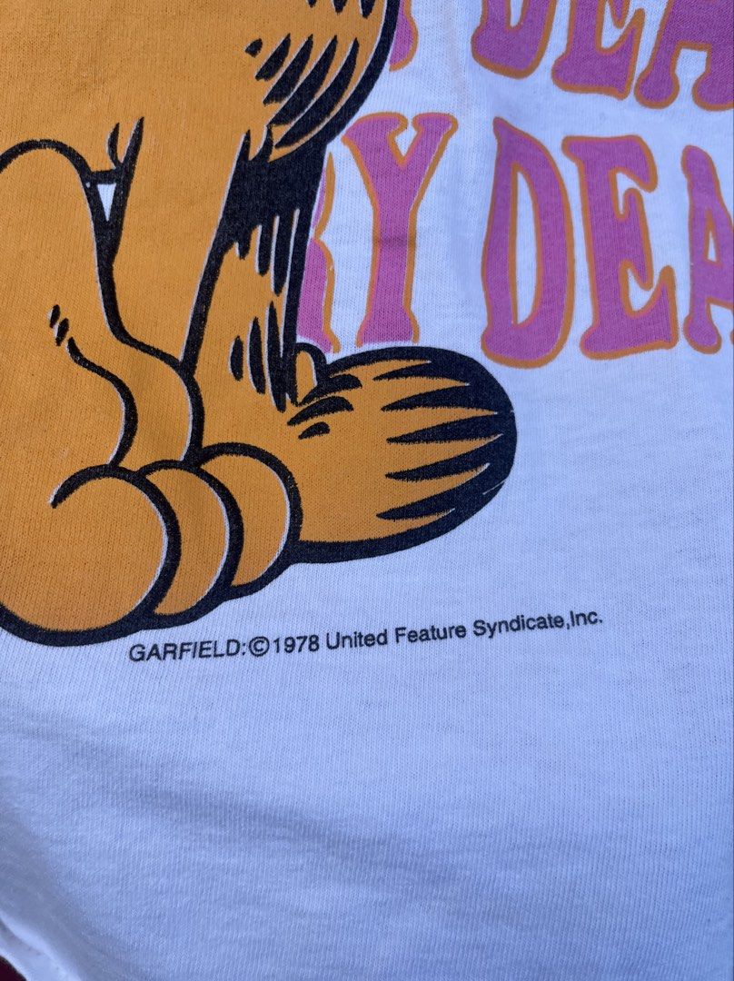True vintage Garfield shirt (Category: Tshirts & Polo Shirts ) located in Cavite. Submitted by thriftniowen (Listing ID 1466467854, Image 3). Description: True vintage Garfield 70s 80s shirt Size medium to large Chest: 21 Length: 24 Condition: good Flaws: stain and pinhole.