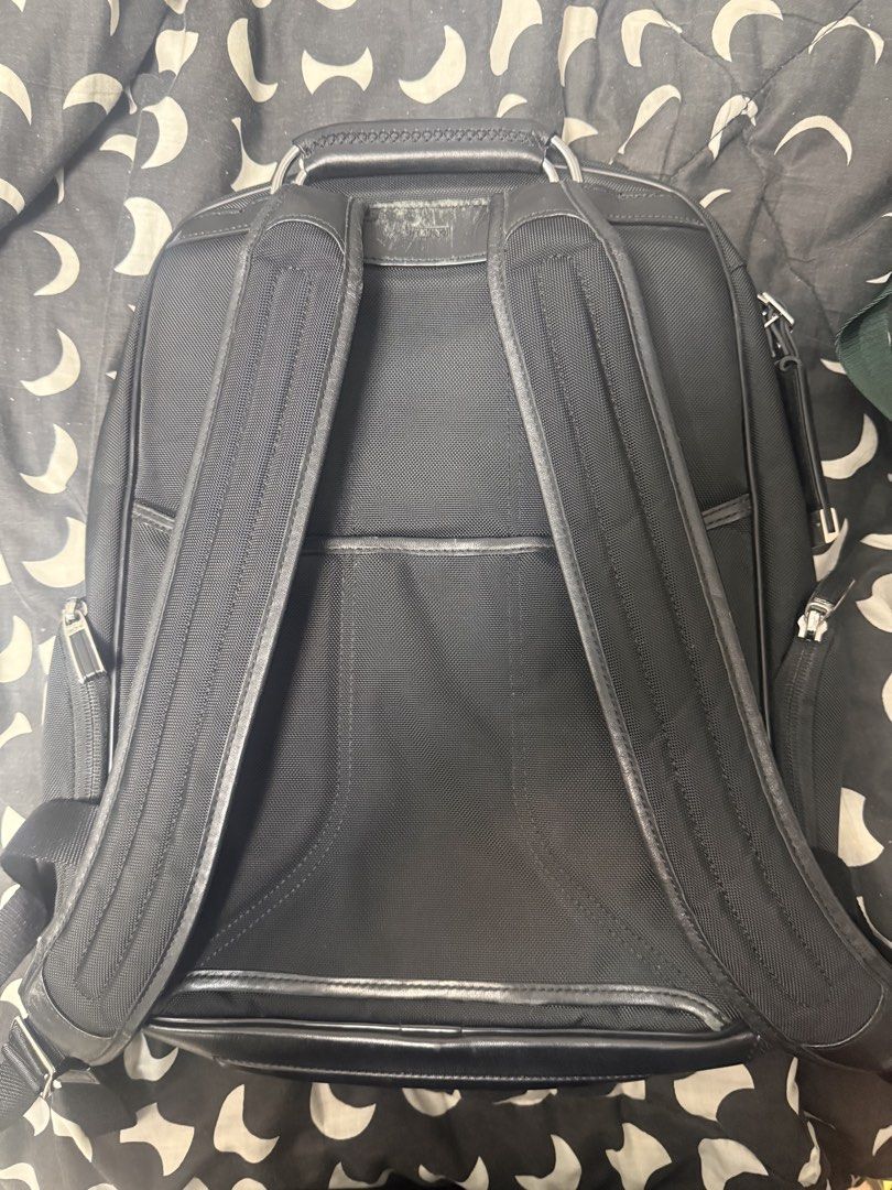 Tumi Arrive Logan Backpack (Category: Backpacks) located in Taytay. Submitted by julesantenor (Listing ID 1466478721, Image 2). Description: Issue is some leather scuffing as seen in the pictures. Also the monogram patch has been engraved. Other than that, backpack is in good condition. Makati location..