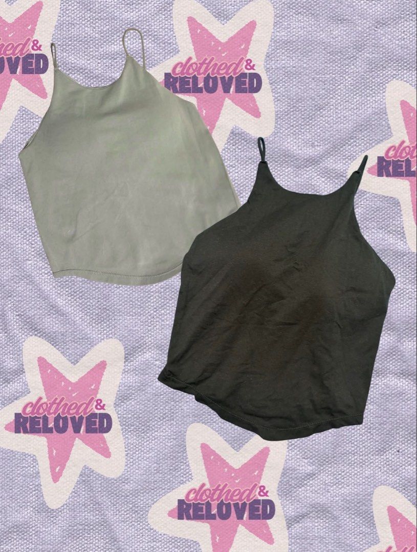 Two Pack Women Tank Tops (Category: Sleeveless) located in Binan City. Submitted by szummie (Listing ID 1466465075, Image 1). Description: - Set of 2 sleeveless tank tops (Gray & Black) - High neckline with sleek thin shoulder straps - Flattering curved hem detail - Comfortable, stretchy fabric ideal for workouts or casual daily wear.