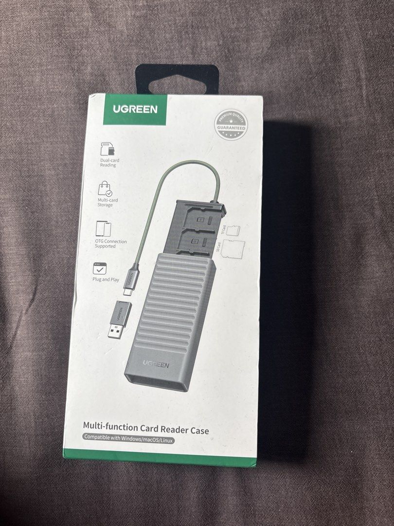 UGREEN Multi-function Card Reader Case (Category: Cases & Sleeves) located in Singapore. Submitted by ducksnapz (Listing ID 1466380279, Image 1). Description: - Brand: UGREEN multi-function card reader case - Features: Dual-card reading and multi-card storage - Connectivity: OTG supported, plug and play (no drivers needed) - Compatibility: Works seamlessly with Windows, macOS, and Linux - Condition: Brand new Unopened Selling cuz i bought extra.