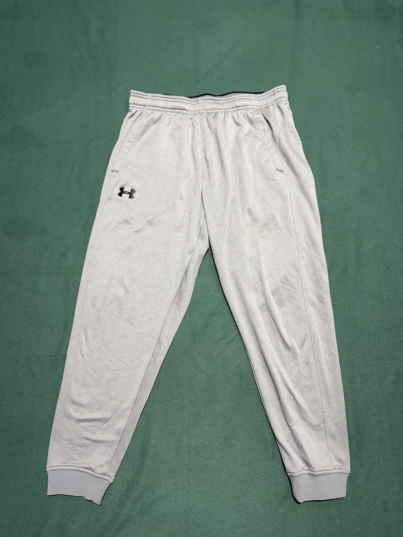 Under Armour ColdGear Loose Sweatpants Grey Large (Category: Joggers) located in Guihulngan. Submitted by fbthriftgoodsniace (Listing ID 1466366276, Image 1). Description: - Brand: Under Armour - Size: Large - Color: Solid grey with black logo on right thigh - Fit: Loose fit with elastic drawstring waistband and ribbed cuffs - Technology: ColdGear to keep you warm - Features: Dual side pockets - Origin: Made in Jordan.