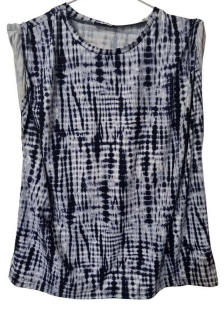 UNIFORM Blue White Tie Dye Sleeveless Top (Category: Sleeveless) located in Quezon City. Submitted by kcobs (Listing ID 1466483322, Image 1). Description: UNIFORM brand sleeveless top, size XL. Blue and white tie dye print with vertical stripe effect. Round neckline, casual relaxed fit. Easy to pair with dark trousers or denim. Great everyday staple piece. Clean and ready to wear. - comfy and still in good condition - Xl but fits large best - gre