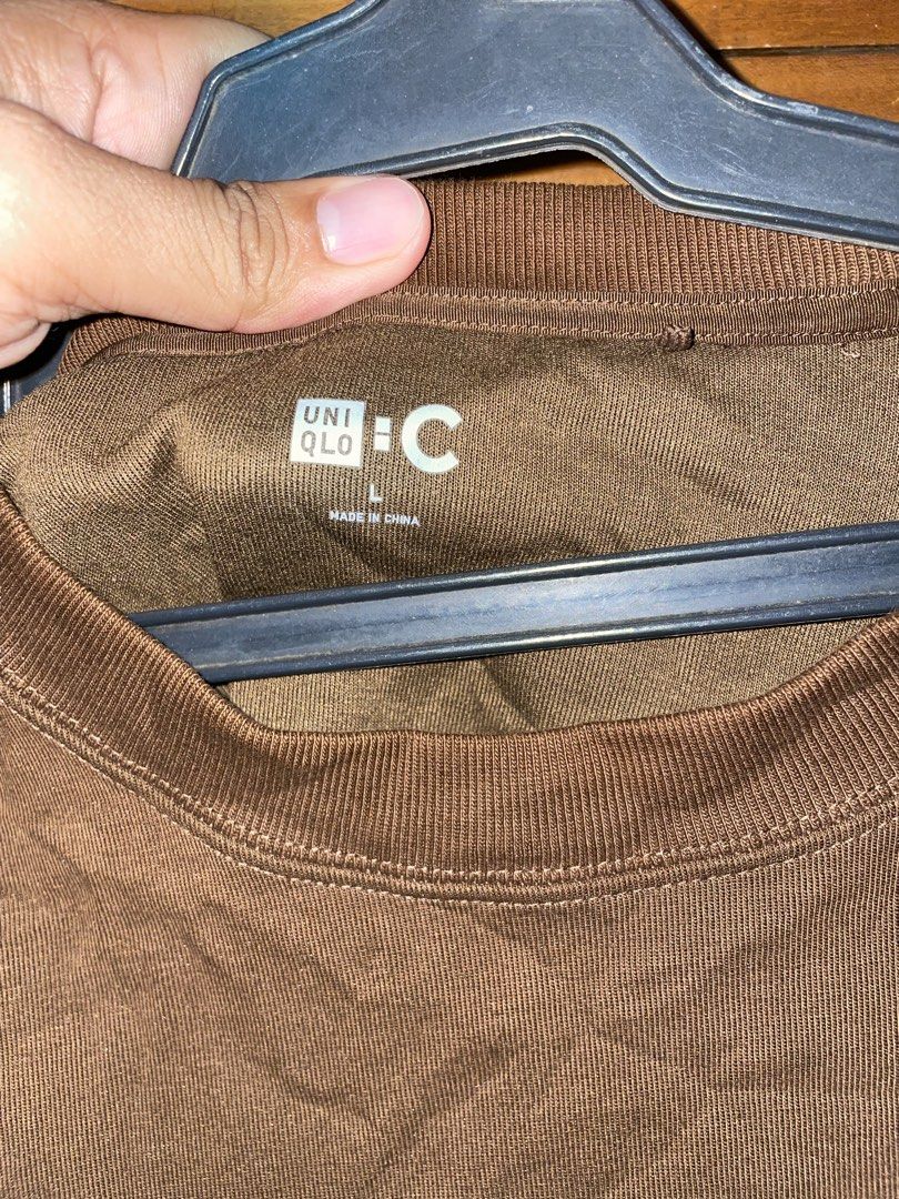Uniqlo C sweatshirt (Category: Hoodies) located in New Bataan. Submitted by rebisa.404 (Listing ID 1466461558, Image 2). Description: Uniqlo C L on tag 23x26.5 Issue pinhole (nasa back) Condition and Colour rate 9.5/10.