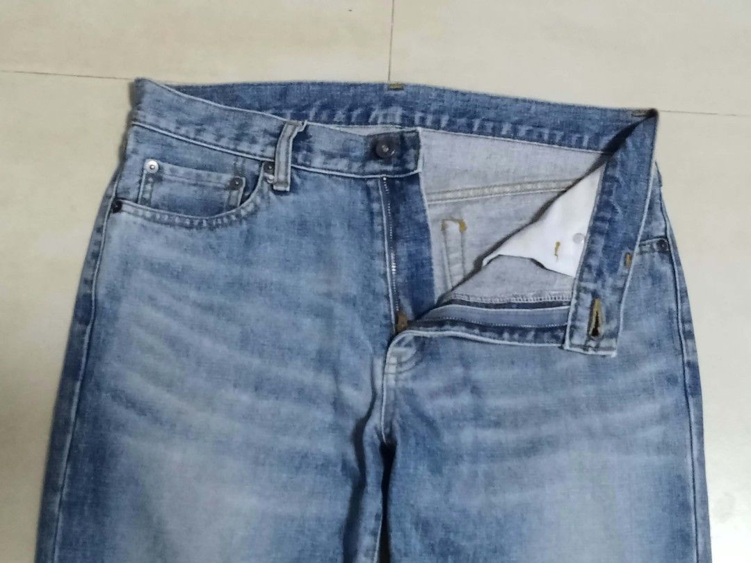 Uniqlo Denim Jeans Size 32 (Category: Jeans) located in Banga. Submitted by althrift_ (Listing ID 1466490603, Image 3). Description: - Brand: Uniqlo - Item: Denim Jeans - Color: Mid blue wash with light fading - Fit: Straight fit - Size: 32 (tag verified) length 40 hem 8 - Details: Classic five-pocket setup, button fly closure - Condition: Clean hems, solid stitching, great everyday casual staple negotiable for right price.