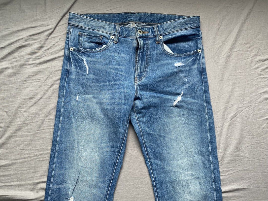 Uniqlo Distressed Blue Jeans Size 31 (Category: Jeans) located in Cavite. Submitted by pax_justinn (Listing ID 1466491139, Image 2). Description: - Brand/Model: Uniqlo Denim Jeans - Color: Light blue wash with trendy distressed details on legs and front pockets - Size: Size 31 (79cm waist) - Material: 99% cotton, 1% spandex blend for a comfortable fit - Closure: Button fly - Origin: Made in Vietnam.