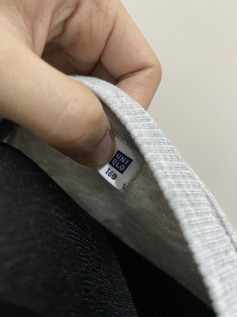 Uniqlo Grey Sweatshirt Size 160 (Category: Coats, Jackets and Outerwear) located in Manila. Submitted by mpt99876 (Listing ID 1466516560, Image 3). Description: - Brand: Uniqlo - Color: Classic heather grey (neutral and easy to match) - Size: 160 (fits petite adults or teens) - Style: Pullover with crew neck and ribbed V-inset - Comfort: Soft fleece interior for extra warmth - Details: Long sleeves with ribbed cuffs and hem - Condition: Great eve