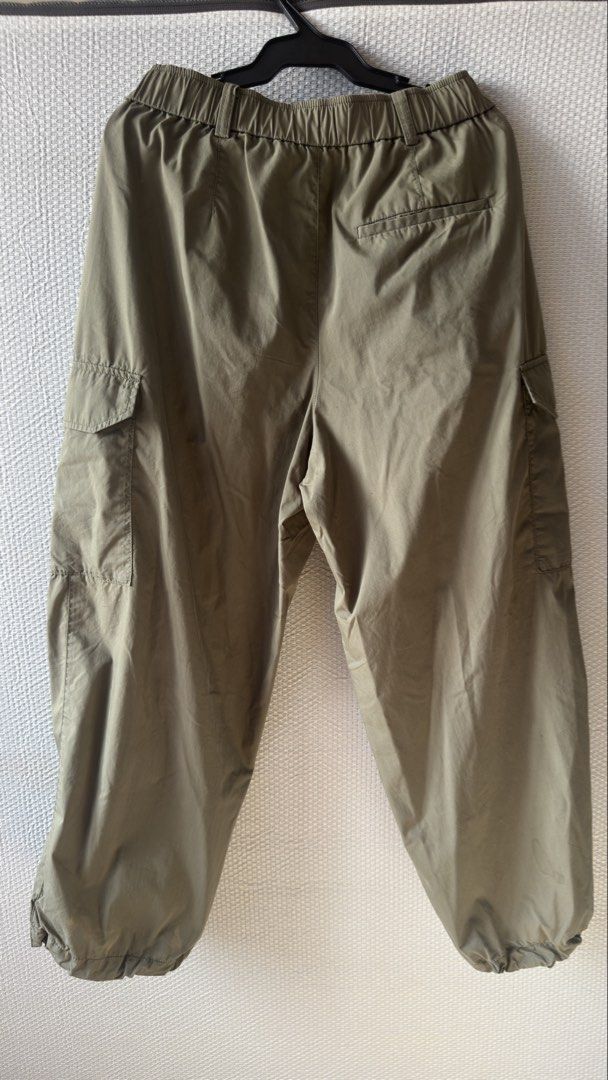 Uniqlo Olive Green Cargo Pants Size S (Category: Jeans) located in Quezon City. Submitted by QuintinZam (Listing ID 1466514204, Image 3). Description: - Brand: Uniqlo - Item: Utility Cargo Pants - Color: Olive Green - Size: S (Fits waist 60-66 cm, Hips 85-91 cm) - Material: 73% Cotton, 27% Nylon - Features: Elastic waistband with belt loops, multiple side cargo pockets, and adjustable cinched ankle cuffs - Fit: Relaxed fit, ideal for casual wear 