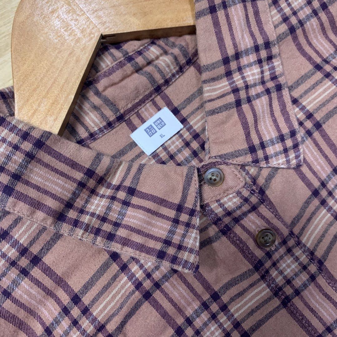 Uniqlo Plaid Long Sleeve Button Down Shirt (Category: Longsleeves) located in Kalibo. Submitted by gneiss2002 (Listing ID 1466357775, Image 3). Description: - Brand: Uniqlo - Style: Long sleeve button-down shirt with classic plaid pattern in mauve and dark purple - Fit: Standard fit with regular collar, button cuffs, and curved hem - Fabric: Lightweight and versatile, great for layering or wearing on its own - Condition: Clean and well-kept.