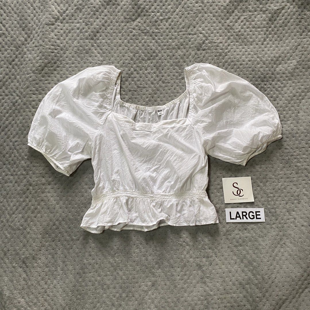 Uniqlo white top (Category: Blouses) located in Ajuy. Submitted by savvyclassics (Listing ID 1466353439, Image 1). Description: .