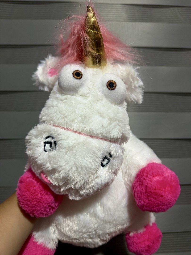 Universal Studios Despicable Me Unicorn sleeping pillow (Category: Plushies & Soft Toys) located in Manila. Submitted by bcbg3217 (Listing ID 1466437162, Image 2). Description: ‼️PLEASE READ BEFORE BUYING‼️ Like new condition Universal studio merch Has a hole in the middle where you can put your hands and use it as a head pillow when traveling Authenticity guaranteed No other inclusions Actual photos are posted No other issues or flaws unless sta
