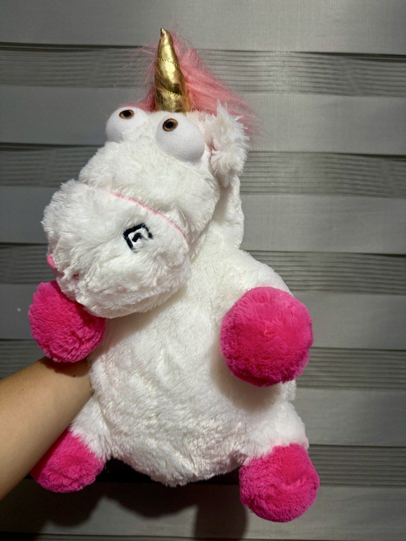 Universal Studios Despicable Me Unicorn sleeping pillow (Category: Plushies & Soft Toys) located in Manila. Submitted by bcbg3217 (Listing ID 1466437162, Image 1). Description: ‼️PLEASE READ BEFORE BUYING‼️ Like new condition Universal studio merch Has a hole in the middle where you can put your hands and use it as a head pillow when traveling Authenticity guaranteed No other inclusions Actual photos are posted No other issues or flaws unless sta