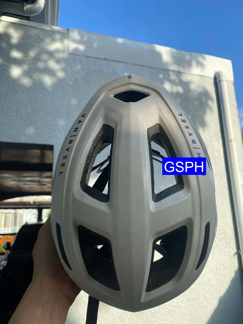 Van Rysel White Cycling Helmet (Category: Bicycles) located in Makati City. Submitted by goodiesstuff_ph_17119811 (Listing ID 1466428830, Image 3). Description: Bought this during the pandemic lockdown of 2021 when biking was a must after that it was never been use again. - Brand: Van Rysel - Color: Clean white finish with black branding - Ventilation: Multiple slots for steady airflow - Fit: Adjustable dial at the back for a snug fit - Ideal for