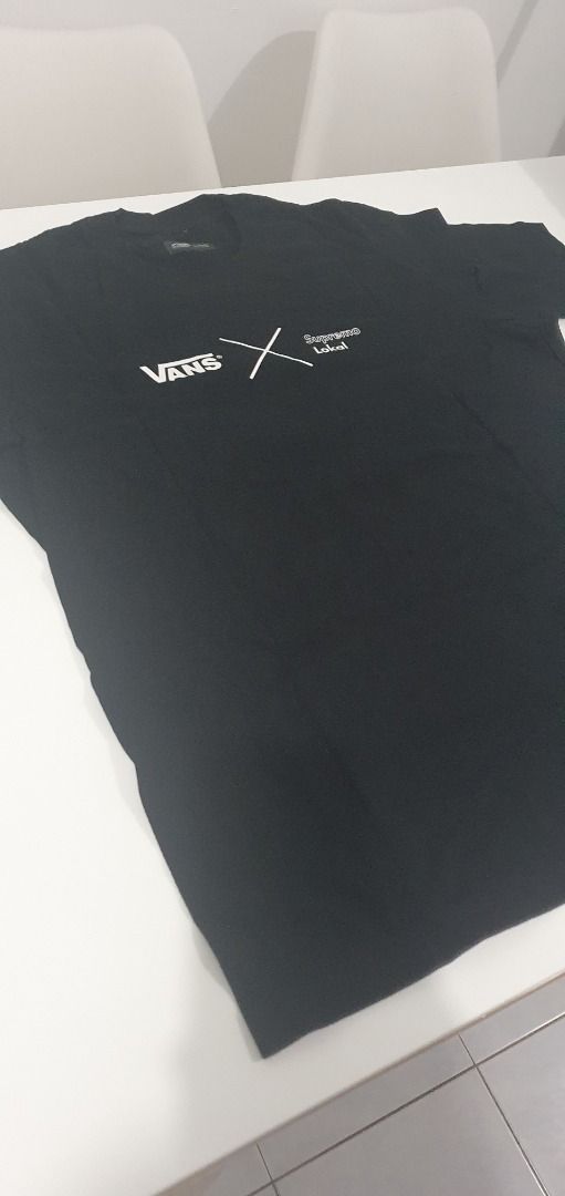 Vans Black Graphic T-Shirt (Category: Tshirts & Polo Shirts ) located in Quezon City. Submitted by sk8ter13 (Listing ID 1466441159, Image 2). Description: - Authentic Vans black short sleeve t-shirt - Features small chest graphics with logo text on the front - Bold large red square logo print with black lettering on the back - Classic crew neck style - Crafted from soft, high-quality cotton fabric - Clean and ready to wear - Measurements availabl