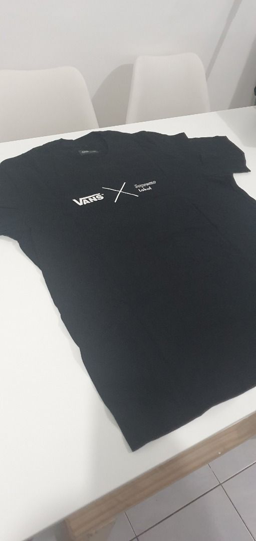 Vans Black Graphic T-Shirt (Category: Tshirts & Polo Shirts ) located in Quezon City. Submitted by sk8ter13 (Listing ID 1466441159, Image 1). Description: - Authentic Vans black short sleeve t-shirt - Features small chest graphics with logo text on the front - Bold large red square logo print with black lettering on the back - Classic crew neck style - Crafted from soft, high-quality cotton fabric - Clean and ready to wear - Measurements availabl