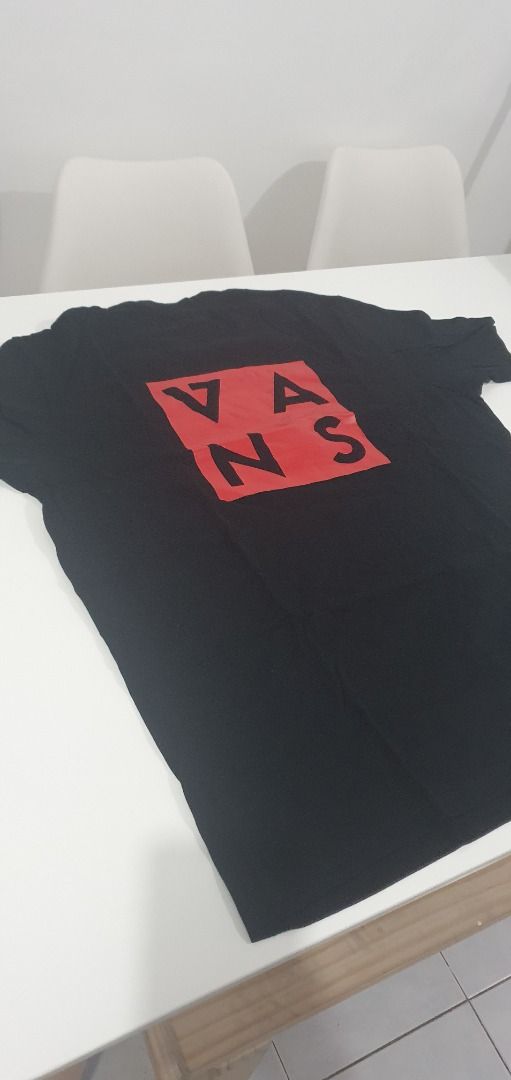 Vans Black Graphic T-Shirt (Category: Tshirts & Polo Shirts ) located in Quezon City. Submitted by sk8ter13 (Listing ID 1466441159, Image 3). Description: - Authentic Vans black short sleeve t-shirt - Features small chest graphics with logo text on the front - Bold large red square logo print with black lettering on the back - Classic crew neck style - Crafted from soft, high-quality cotton fabric - Clean and ready to wear - Measurements availabl