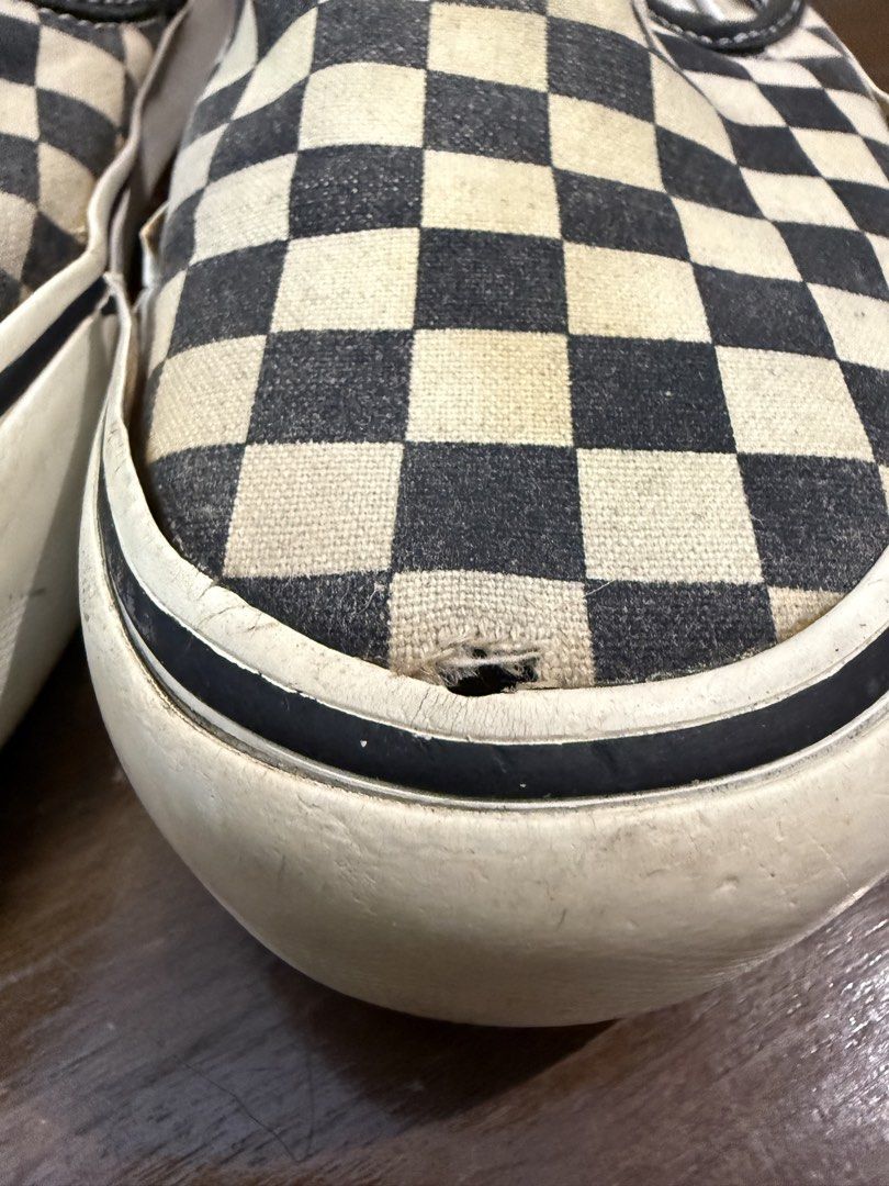 Vans Classic Checkerboard Slip-On (Category: Sneakers) located in Quezon City. Submitted by nsseller (Listing ID 1466460427, Image 2). Description: - Item: Vans Classic Checkered Slip-Ons - Color: Black and White - Size: Men's US 7 / Women's US 8.5 - Condition: Heavy wear with all-over fading, yellowing on soles/fabric, and a small tear on the right toe box - Ideal Use: Perfect everyday beaters or skate shoes - Price: Budget-friendly, priced to s
