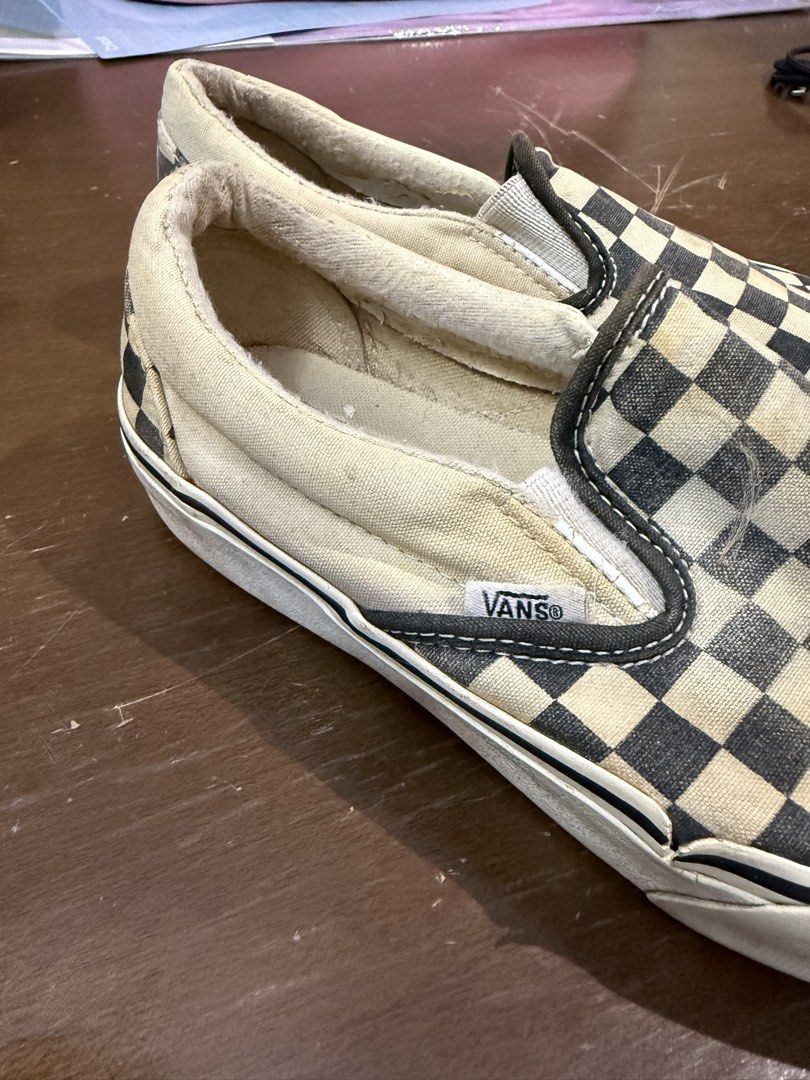 Vans Classic Checkerboard Slip-On (Category: Sneakers) located in Quezon City. Submitted by nsseller (Listing ID 1466460427, Image 3). Description: - Item: Vans Classic Checkered Slip-Ons - Color: Black and White - Size: Men's US 7 / Women's US 8.5 - Condition: Heavy wear with all-over fading, yellowing on soles/fabric, and a small tear on the right toe box - Ideal Use: Perfect everyday beaters or skate shoes - Price: Budget-friendly, priced to s