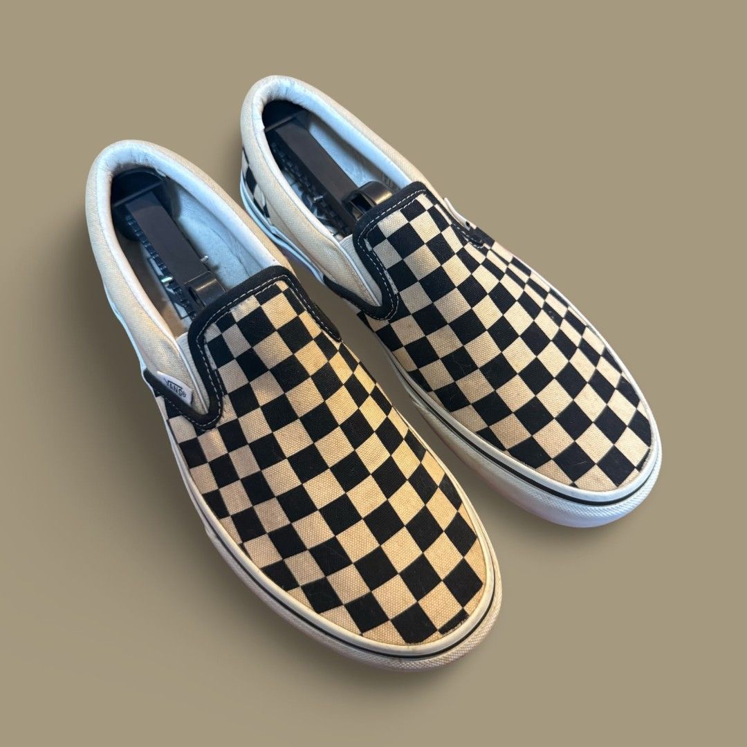 Vans Classic Slip-On Checkerboard Black White (Category: Casual Shoes) located in Del Monte. Submitted by jasonjuan31 (Listing ID 1466498068, Image 2). Description: - Brand: Vans Classic Slip-On sneakers - Design: Iconic black and white checkerboard canvas upper - Features: Easy slip-on style with elastic side accents, white rubber midsoles, and signature waffle outsoles - Sizing: Men's sizing (refer to inner tags) - Condition: Shows slight yello