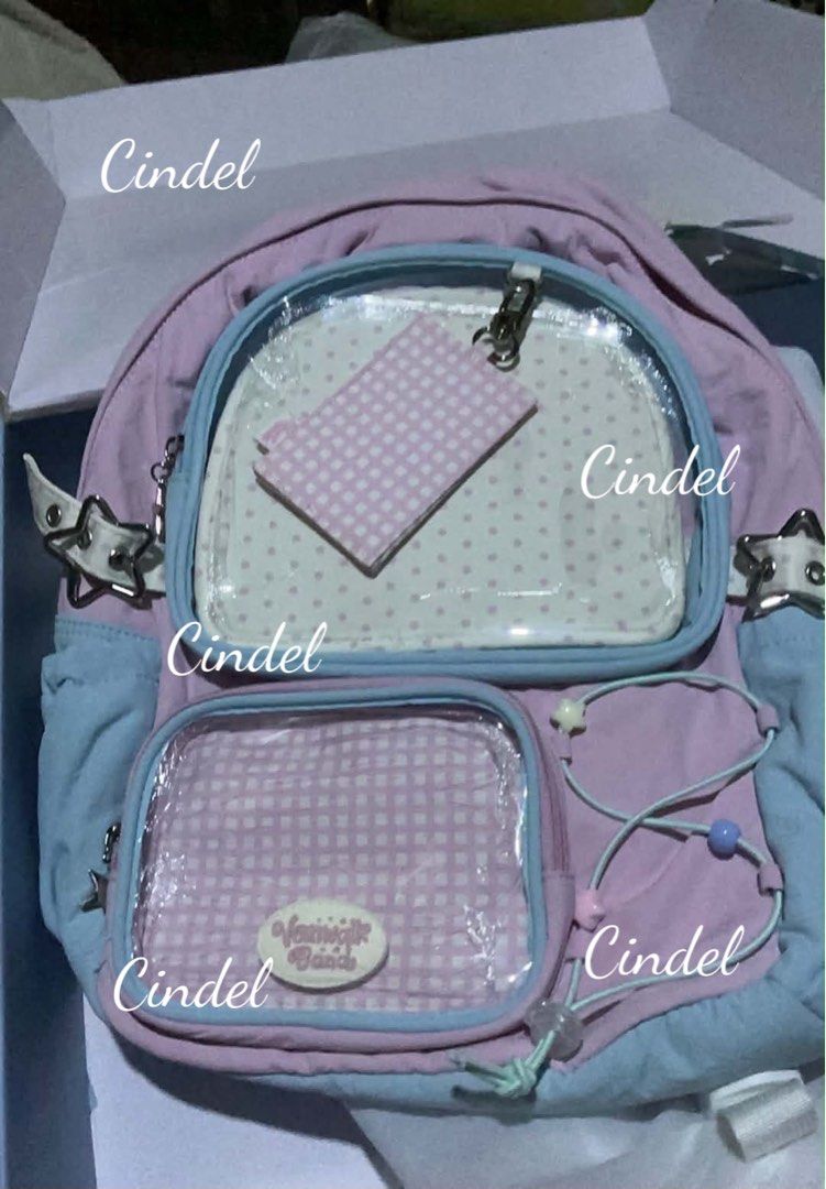 Vanwalk Ita Backpack Pink Light Blue with Box and Freebies (Category: Backpacks) located in Manila. Submitted by cindeld.173 (Listing ID 1466373367, Image 2). Description: - Brand: Vanwalk - Colorway: Pink and Light Blue - Features: Clear front pocket for ita bags/pins, star buckle straps on the sides - Interior: Clean fabric lining with a zip pocket and slip compartments - Inclusions: Original box included - Freebies: Punch-out paper craft, smal