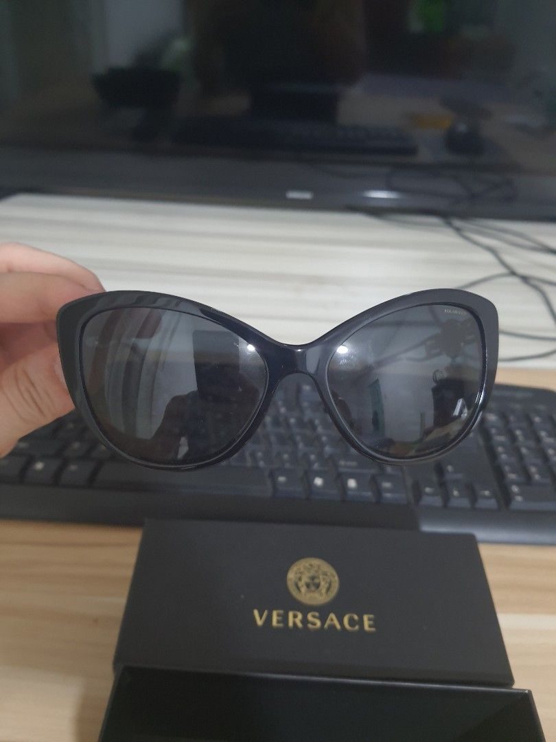 Versace Black Polarized Sunglasses with Case (Category: Sunglasses & Eyewear) located in Manila. Submitted by anthonylee23810 (Listing ID 1466451239, Image 1). Description: - Authentic Versace sunglasses featuring a classic black frame - Polarized dark lenses for ultimate glare protection and clear vision - Durable, sturdy build with a clean and sleek designer aesthetic - Ideal for daily wear, outdoor activities, and driving - Complete set includ