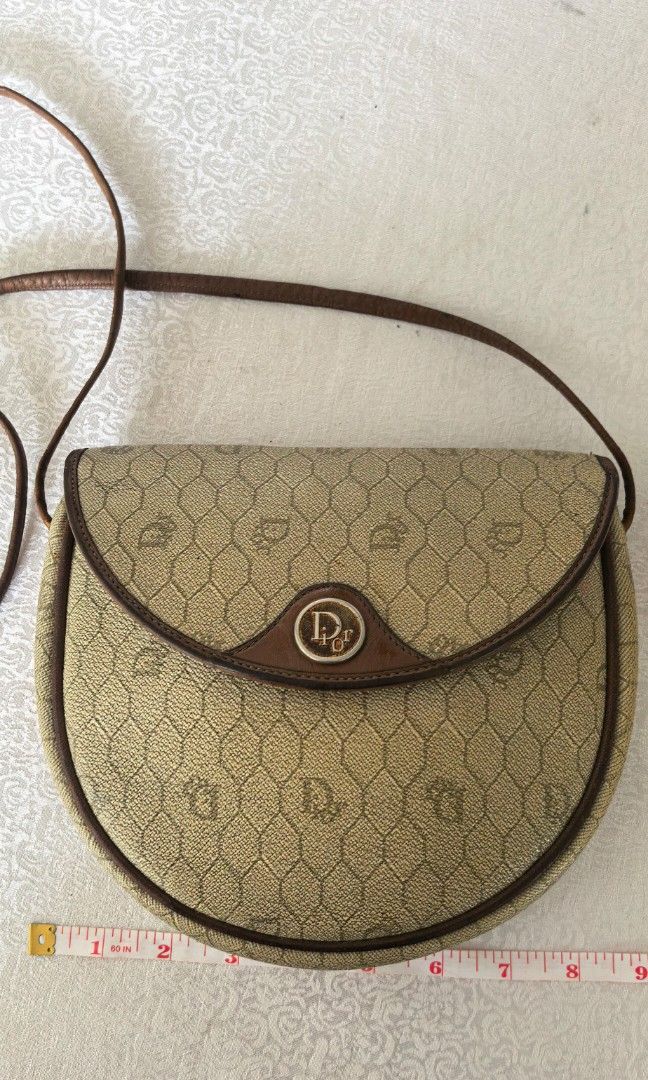 Vintage CD coated monogram canvass (Category: Cross-body Bags) located in Tuguegarao City. Submitted by zenphoenix-7ad615 (Listing ID 1466418526, Image 1). Description: Sale With signs of use sa mga leather part.