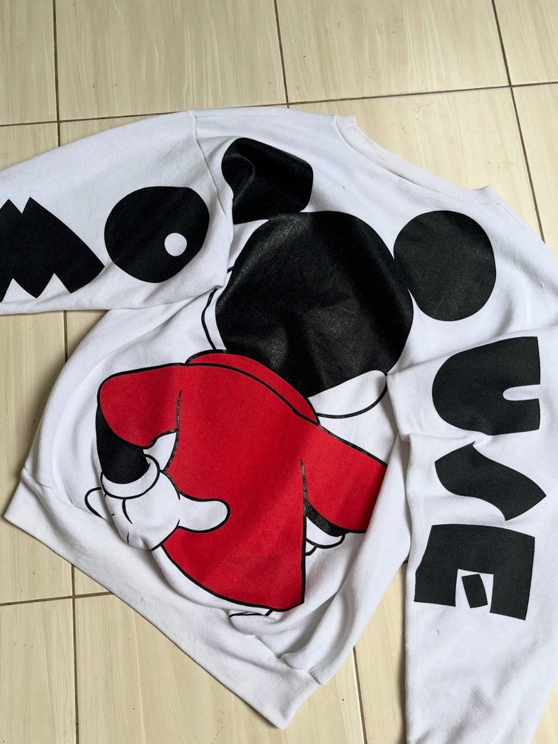 Vintage Disney Mickey Mouse White Oversized Sweatshirt Large (Category: Coats, Jackets and Outerwear) located in Manila. Submitted by thrifted.shits (Listing ID 1466496656, Image 2). Description: Vintage white Disney Mickey Mouse sweatshirt, size L. Features large front and back graphics with lettered sleeves. Made in USA.