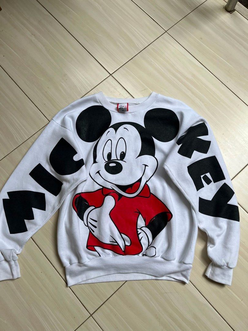 Vintage Disney Mickey Mouse White Oversized Sweatshirt Large (Category: Coats, Jackets and Outerwear) located in Manila. Submitted by thrifted.shits (Listing ID 1466496656, Image 3). Description: Vintage white Disney Mickey Mouse sweatshirt, size L. Features large front and back graphics with lettered sleeves. Made in USA.