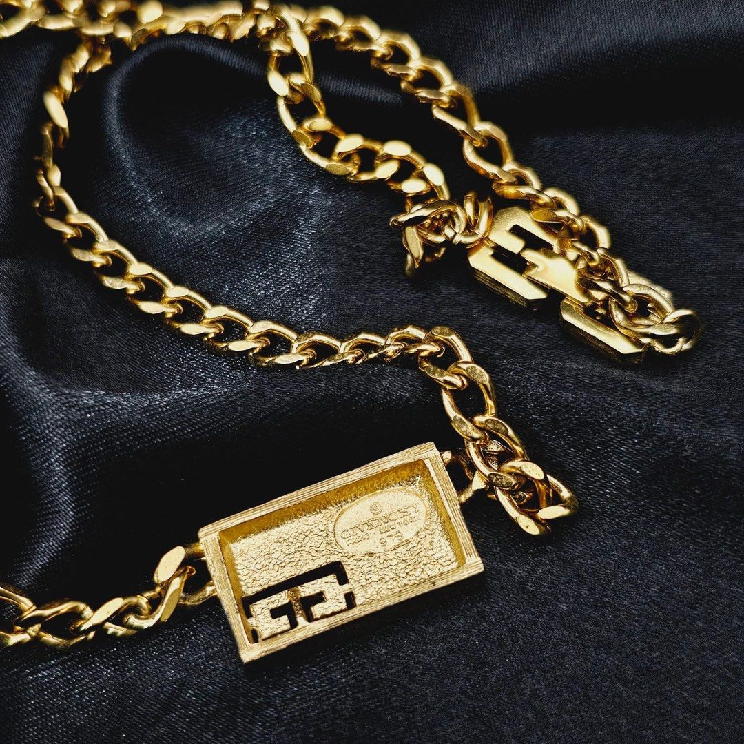 VINTAGE GIVENCHY TAG CHAIN NECKLACE ✨ (Category: Necklaces) located in Mandaluyong City. Submitted by luxprelovedbagsparadise (Listing ID 1466452546, Image 3). Description: ✨ VINTAGE GIVENCHY TAG NECKLACE ✨ Vintage luxury with a modern edge. 🤌🏻✨ This statement Givenchy piece features a sleek rectangular ID plate, signature G logo detail, and a classic curb chain finished with iconic G-logo links on the extension and clasp. 💛 Gold-plated finish