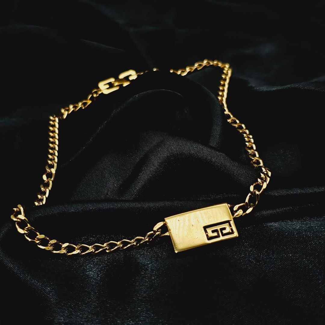 VINTAGE GIVENCHY TAG CHAIN NECKLACE ✨ (Category: Necklaces) located in Mandaluyong City. Submitted by luxprelovedbagsparadise (Listing ID 1466452546, Image 1). Description: ✨ VINTAGE GIVENCHY TAG NECKLACE ✨ Vintage luxury with a modern edge. 🤌🏻✨ This statement Givenchy piece features a sleek rectangular ID plate, signature G logo detail, and a classic curb chain finished with iconic G-logo links on the extension and clasp. 💛 Gold-plated finish