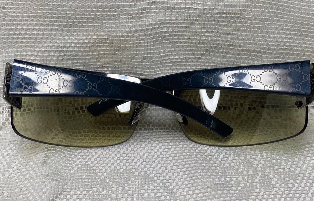 Vintage Gucci sunglasses (Category: Sunglasses & Eyewear) located in Angeles City. Submitted by noagrace (Listing ID 1466348941, Image 2). Description: Gucci GG 1823/S Shield Sunglasses from the early 2000s Tom Ford era. studded hardware details. Normal signs of use 1 missing stud P1300.