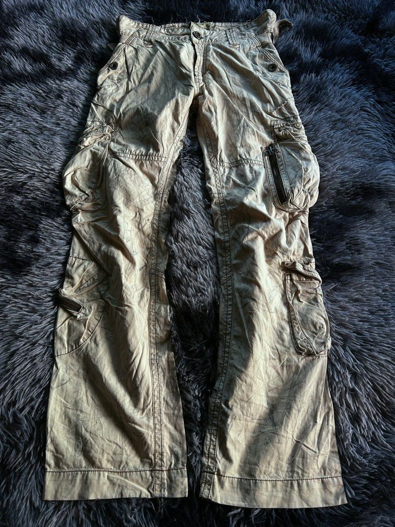 Vintage Flared GOA (Alternative) Utility Multi Pocket Cargo Pants (Category: Jeans) located in Baao. Submitted by prettysixtythrift_17 (Listing ID 1466350184, Image 1). Description: Vintage Y2k Japanese Brand Flared Mass and Only Utility Multi Pocket Cargo Pants ▪️Waistline: 32 to adjustablebuckle ▪️Length: 41 ▪️Hem: 9 ▪️Hips: 15 ▪️Leg Thigh: 11 ▪️Rise: 10.5 ▪️Inseam: 32.