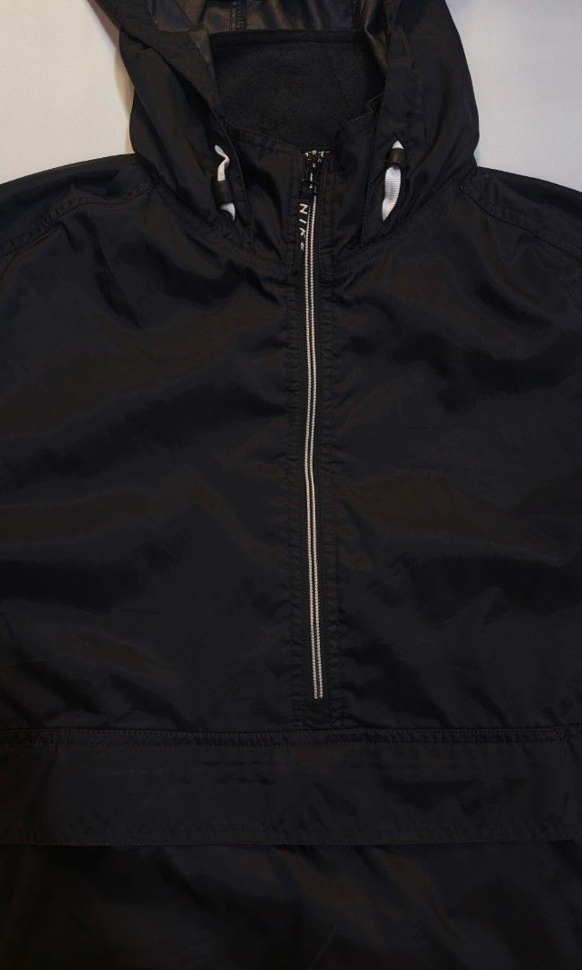 Vintage Nike Half-Zip Anorak Jacket (Category: Coats, Jackets and Outerwear) located in Canlaon. Submitted by thriftytrift (Listing ID 1466405081, Image 3). Description: Size: L Nylon shell | Made in Sri Lanka Condition: [e.g. 9/10, no holes or stains] Embroidered white Nike swoosh on the lower front Half-zip with the "NIKE" zip pull Large front kangaroo pocket with a zip Velcro cuff straps Mesh-lined body, nylon-lined hood Red swoosh Nike neck t