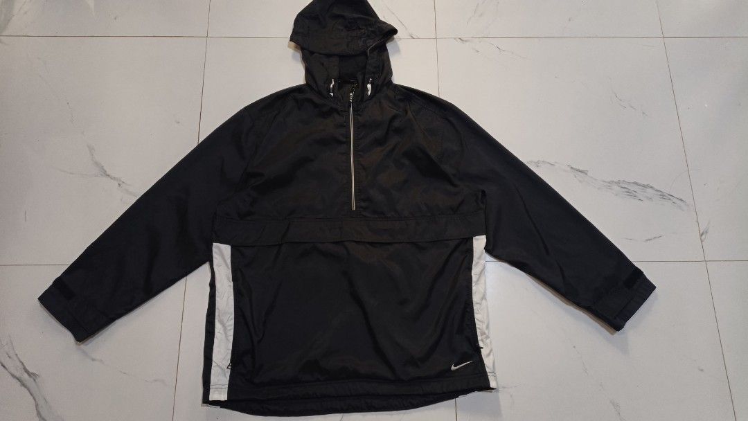Vintage Nike Half-Zip Anorak Jacket (Category: Coats, Jackets and Outerwear) located in Canlaon. Submitted by thriftytrift (Listing ID 1466405081, Image 1). Description: Size: L Nylon shell | Made in Sri Lanka Condition: [e.g. 9/10, no holes or stains] Embroidered white Nike swoosh on the lower front Half-zip with the "NIKE" zip pull Large front kangaroo pocket with a zip Velcro cuff straps Mesh-lined body, nylon-lined hood Red swoosh Nike neck t