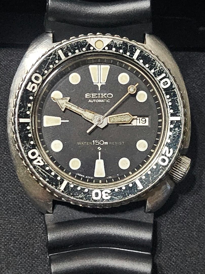 Vintage Seiko JDM "Turtle" Automatic Diver 6306-7001 (Category: Men's Watches) located in Valenzuela. Submitted by habejavier (Listing ID 1466447159, Image 2). Description: - BMBY: Nov 1976 - Dial: All original aged dial with patinated lume hands - Bezel: Rotating original black bezel - Case: Unpolished stainless steel case - Strap: Fitted with a comfortable black ribbed NATO strap - Movement: Automatic 6306-7001 with hacking function, cleaned an