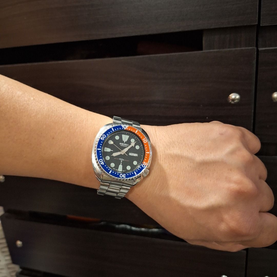 VINTAGE Seiko Pepsi Watch (Category: Men's Watches) located in General Trias. Submitted by aeunice (Listing ID 1466428496, Image 1). Description: Vintage Seiko automatic dive watch 150m Water Resistance In Good Condition. Featuring a classic cushion case, striking blue and orange rotating bezel and black dial. Comes with a stainless steel bracelet, day/date window and screw-down crown. Compatible with both Jubilee and Oyster style bracelets. Read