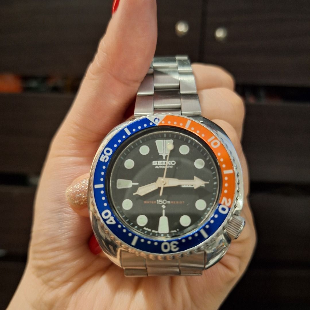 VINTAGE Seiko Pepsi Watch (Category: Men's Watches) located in General Trias. Submitted by aeunice (Listing ID 1466428496, Image 2). Description: Vintage Seiko automatic dive watch 150m Water Resistance In Good Condition. Featuring a classic cushion case, striking blue and orange rotating bezel and black dial. Comes with a stainless steel bracelet, day/date window and screw-down crown. Compatible with both Jubilee and Oyster style bracelets. Read