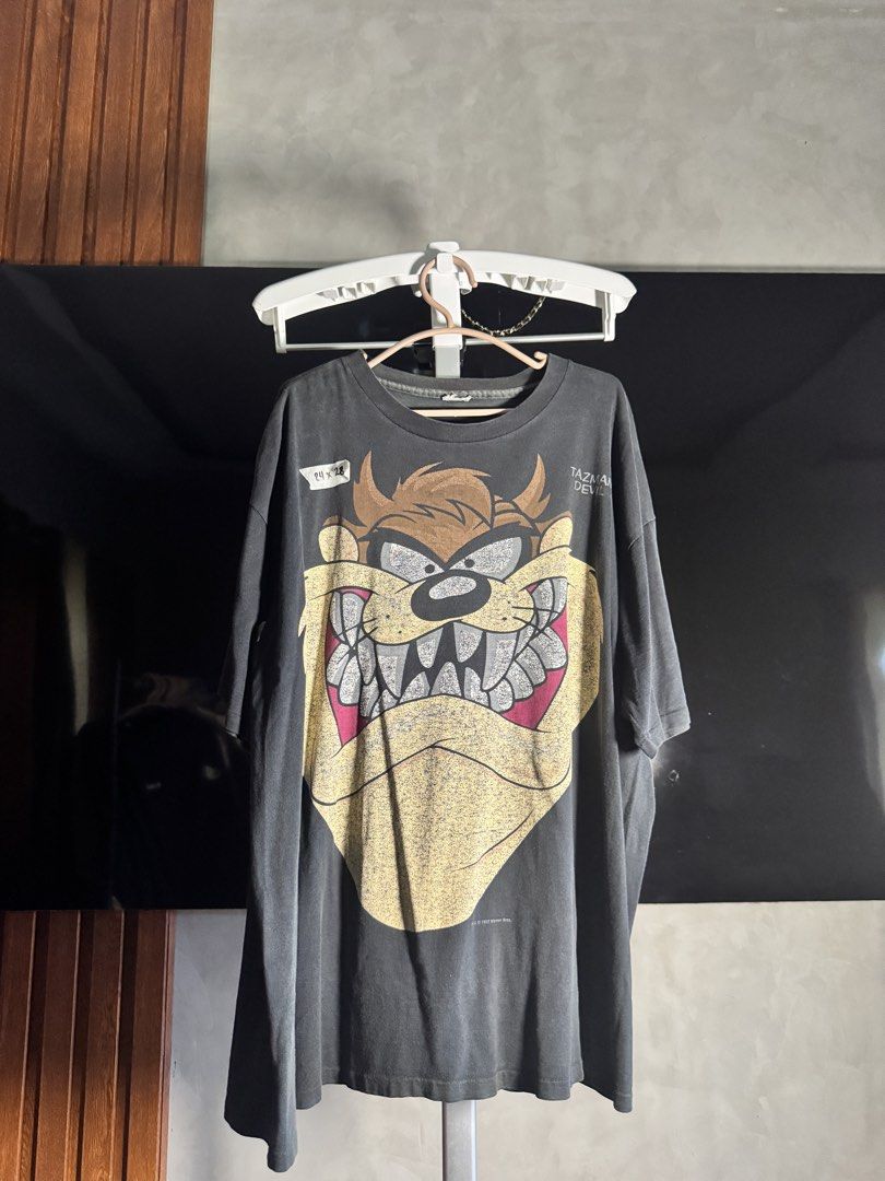 Vintage Taz 1993 (Cut tag “Artex” (Category: Tshirts & Polo Shirts ) located in Laoag. Submitted by quin.r (Listing ID 1466408896, Image 1). Description: Vintage Taz dated 1993 Artex tag (cut tag) 24x28 Single stitch all over (1-1-1) Slight distressed neckline Armpit hole Excellent Vintage Fade Shipped price Slightly nego.