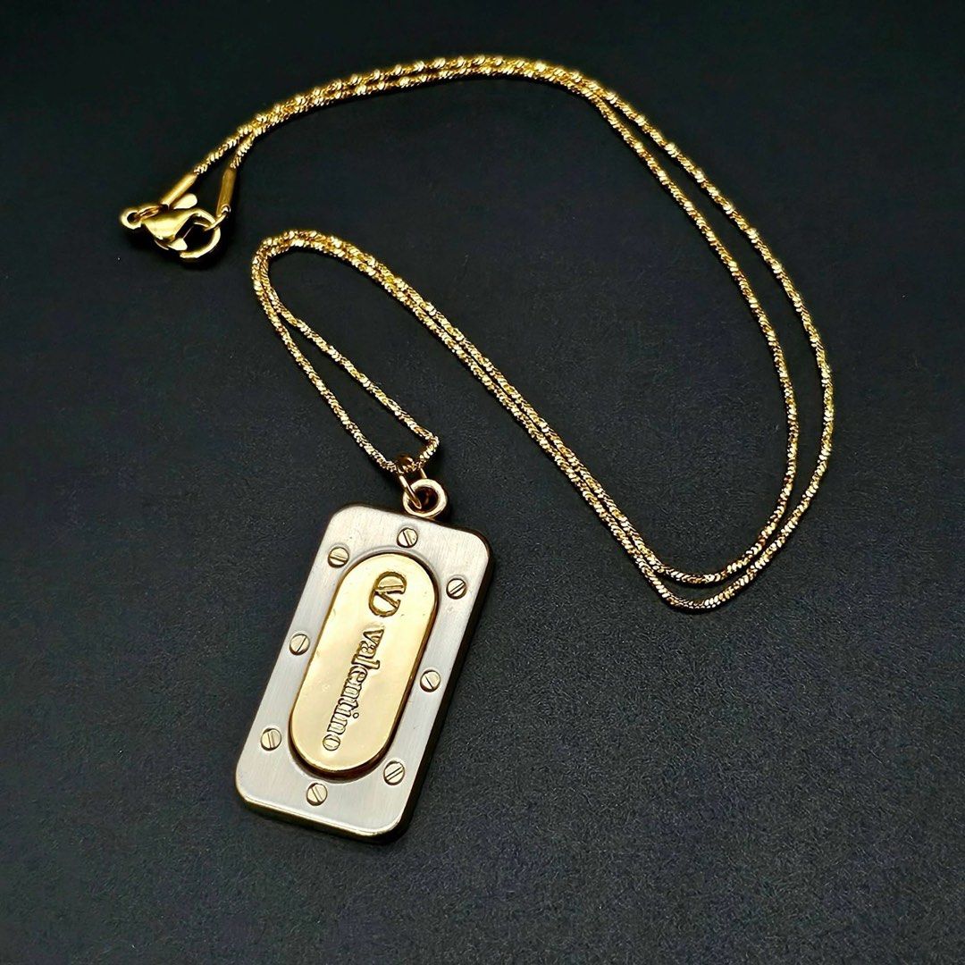 VINTAGE VALENTINO TAG NECKLACE ✨ (Category: Necklaces) located in Mandaluyong City. Submitted by luxprelovedbagsparadise (Listing ID 1466451709, Image 1). Description: ✨ VINTAGE VALENTINO TAG NECKLACE ✨ A timeless vintage piece with that effortlessly classy, statement-making look. 🤎✨ 💛 Gold-Plated Finish 🔲 Rectangular Tag Pendant ✨ Engraved Valentino Brand 🔩 Signature Flathead Screw Details 🕰️ Vintage Design 📦 ON HAND & READY TO SHIP 🔥 STE
