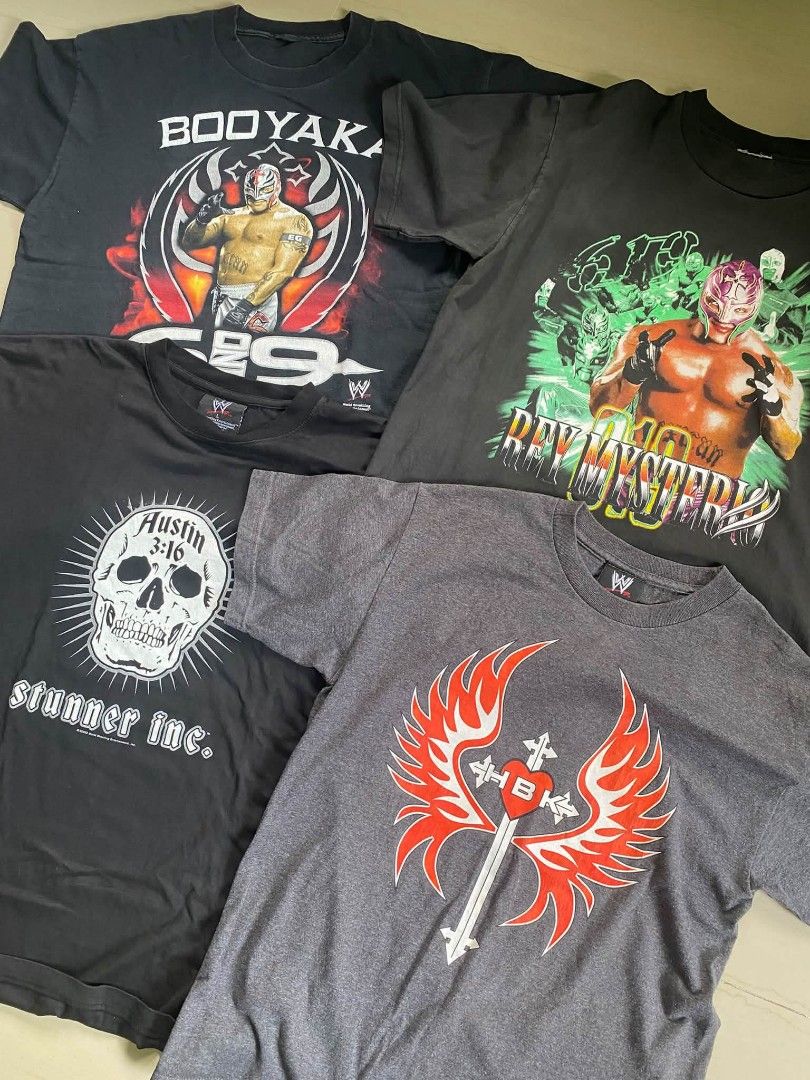 Vintage wrestling tees ♻️ (Category: Tshirts & Polo Shirts ) located in San Miguel. Submitted by jackcurateddept (Listing ID 1466365188, Image 1). Description: WTS! ♻️ Booyaka official cut tag 22.5x28 Mysterio green cut white 22x27 Stone cold stunner official 2003 large on tag 24x29 deadstock condi HBK official 2003 20x27 deadstock condi DM 👋🏻.